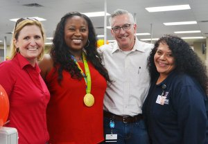 Chief Financial Officer Jim Jordan celebrates Customer Service week with Senior Vice President Jami Richardson, Olympic Gold Medalist Michelle Carter and President and Chief Merchandising Officer Ana Middleton.