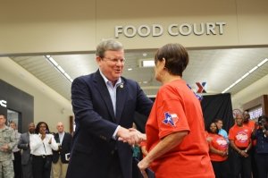 Director/CEO Tom Shull greets an associate at the Fort Hood grand opening.