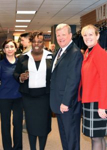 Director/CEO Tom Shull awards his coin to Store Manager Karen Anderson as he helps open the new MCS at the Pentagon.