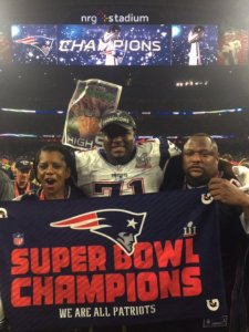 Col. Fleming, left, celebrates the Patriots win with her son at Super Bowl LI.