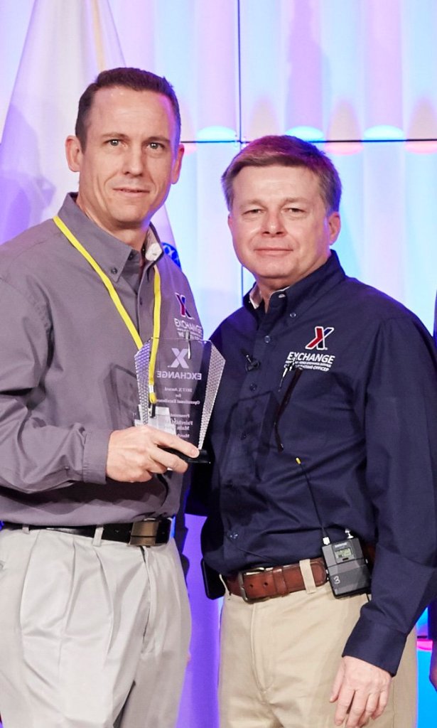 COO Dave Nelson congratulates General Manager Michael Einer on his Exchange winning the COO award at the recent MSM/GM Conference.