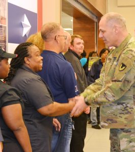 GEN Perna shook the hand of each associate recognized, including Rita King.