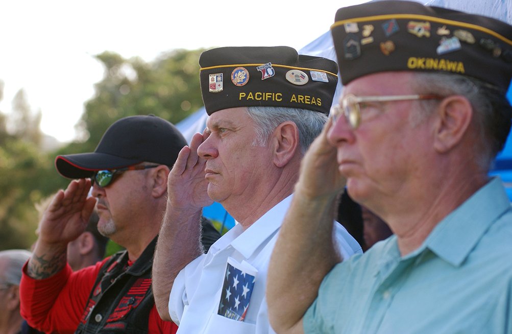 Veterans salute as flags are raised for the National Anthem during a Memorial Day ceremony at Kadena Air Base, Japan, May 26. Veterans and military members from all four branches of the military attended the event to remember those who died in our nation's service. (U.S. Air Force photo/Tech. Sgt. Rey Ramon) (Released)