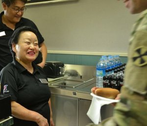 Kim, Man-So serves a snack at U.S. Army Garrison Yongsan, Korea.