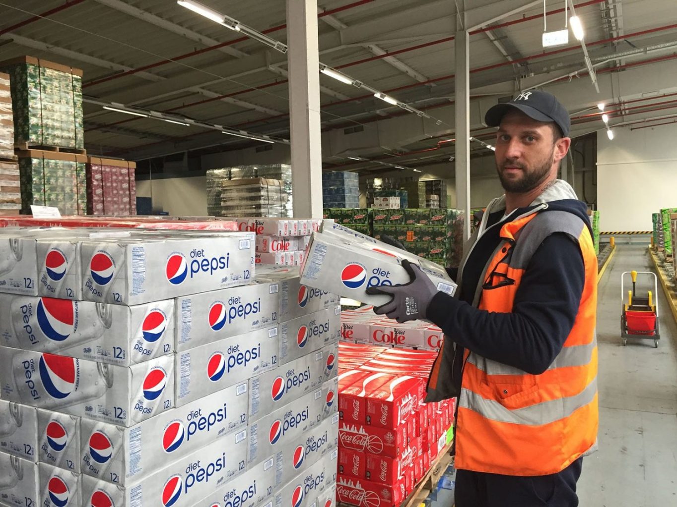 GeDC warehouse associate Derrick Kennedy stocks and picks soda ready to ship to Exchanges and commissaries across Europe.