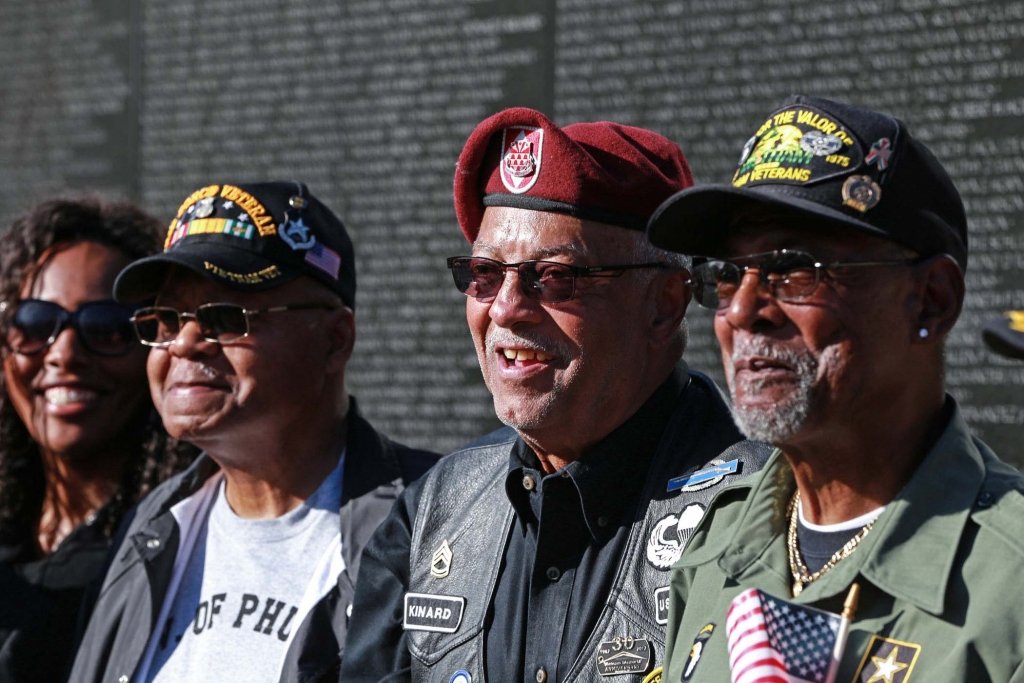 Veterans standing by the Vietnam Memorial Wall in Washington, D.C. Director/CEO Tom Shull played a key role in the building of the wall. To see a video of this story, go to the Exchange Facebook page.(VA/Reynaldo Leal)