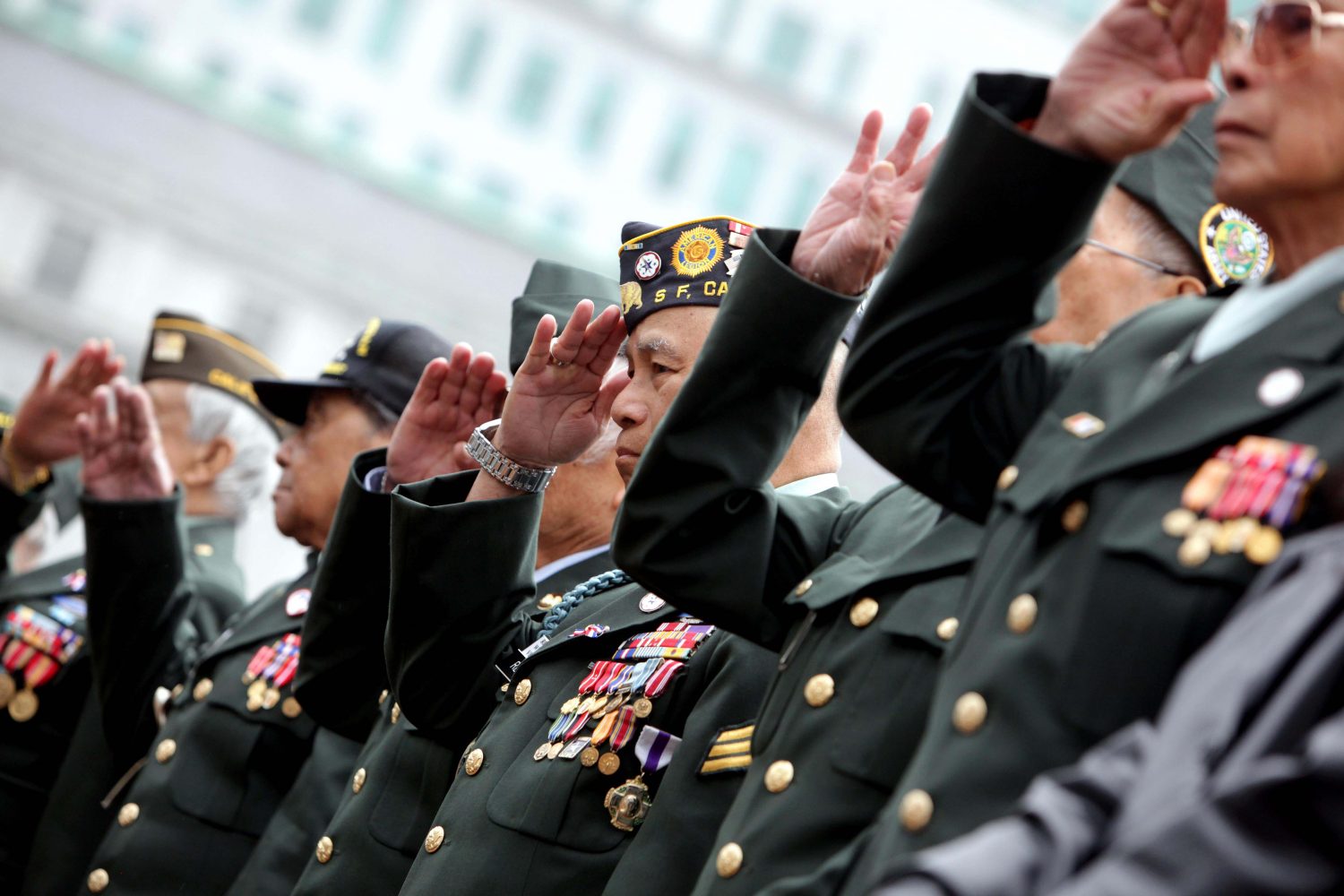 Members of the Veterans Affairs Commission for the City and County of San Francisco salute participants in the annual Veterans day parade in San Francisco, Calif., on Friday, November 11, 2011.