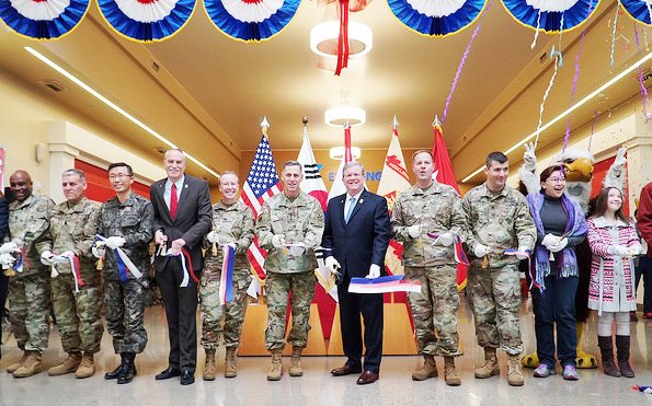 Director/CEO Tom Shull (center), Lt. Gen. Tom Vandal, commanding general, 8th Army, and other Exchange and military leaders ushered in a new shopping experience for Soldiers and families who call Camp Humphreys home.