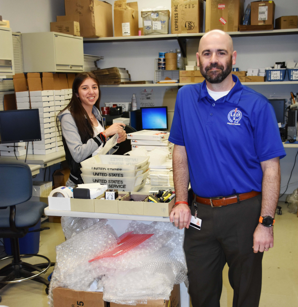 Associate Jennifer Hernandez busily prepares boxes of merchandise to send to the Exchange’s shipper.