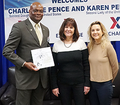 General Manager Lawrence Simmons holds a copy of the book by Vice President Mike Pence's wife, Karen, and their daughter Charlotte