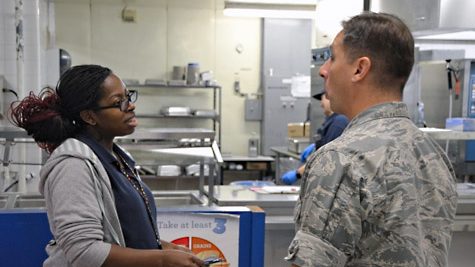 Summer Turner tells Pacific Region Commander Col. Scott Maskery how she operates her school lunchroom.