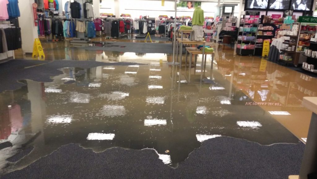 NAS JRB Exchange Family Comes Together When Flooding Strikes - Water, rather than merchandise, occupies major space in the main store after a water pipe busted, shutting down the facility for five days.