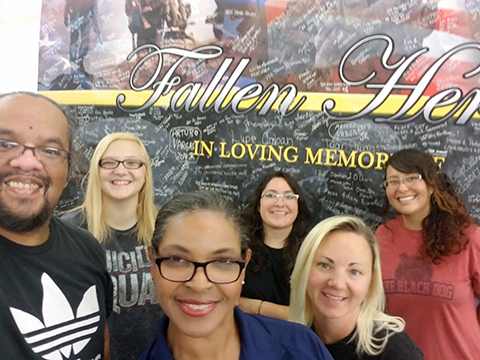 Main Store Manager Paula Bradford, front, and visual merchandisers at Fort Bliss created a display honoring Warfighters lost in action.