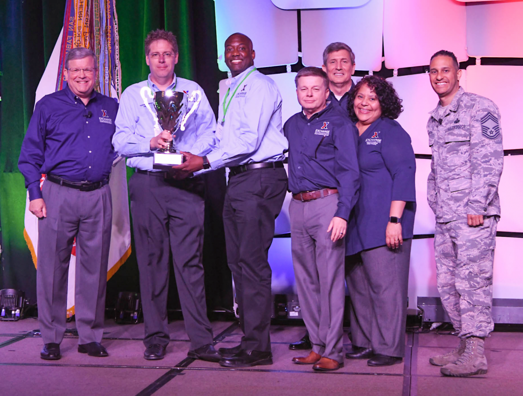 Fort Campbell's Exchange was awarded the Director/CEO Cup in the Super category annual Main Store Managers/General Managers Conference. Pictured (left to right): Exchange Director/CEO Tom Shull; Fort Campbell General Manager David Swenson; Main Store Manager Jermaine Wilson; Chief Operating Officer Dave Nelson; Chief Administrative Officer Phil Stevens; President Ana Middleton; and Chief Master Sgt. Luis Reyes.