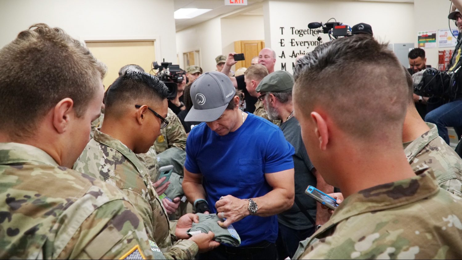 Actor Mark Wahlburg signs autographs at the Fort Benning Exchange during a special visit to greet Soldiers.