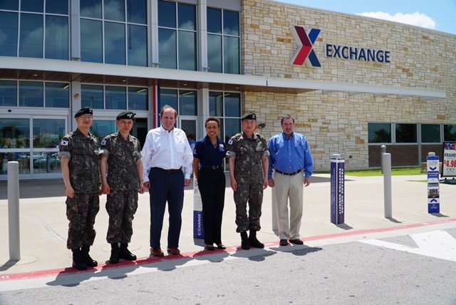 Republic of Korea MG Sangbum Shin, second from right, visits the Fort Hood Exchange with two of his top assistants. Joining them are Tom Lozier, the Exchange's senior vice president for supply chain, Main Store Manager Sandra Reed and Alan French, vice president of the Logistics Directorate. COL Sukwon Lee and LTC Jinwook Lee