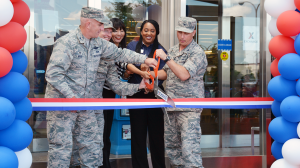 YOKOTA AB, Japan - From left, Col. Kenneth Moss, 374th Airlift Wing commander; Col. John Winkler, 374th Mission Support Group commander; Shinobu Matsui, Exchange general manager; Latoya Harris, main store manager; and Col. Scott Maskery, Exchange Pacific Region commander, cut the ribbon June 1 on the renovated Yokota Exchange.