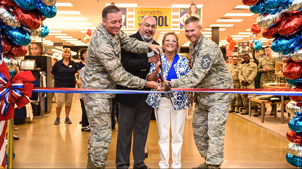 Central Region Vice President Larry Salgado and General Manager Annette Montgomery join base leaders in opening the remodeled Exchange.