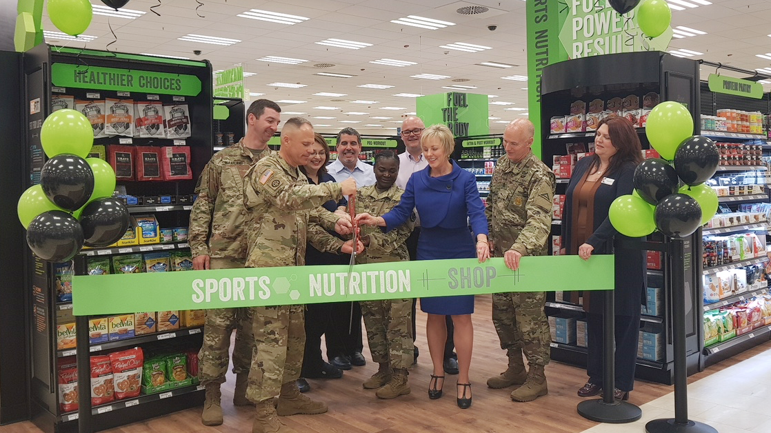 Exchange managers and installation commanders cut the ribbon during the festive grand-opening celebrations.