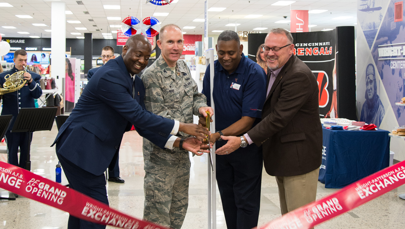 Col. Leonard Rose, commander, 88th Mission Support Group joins General Manager Jermaine Wilson, Store Manager Donald Basil and Central Region Vice President Ronny Rexrode grand opening ceremonies of the renovated Exchange.