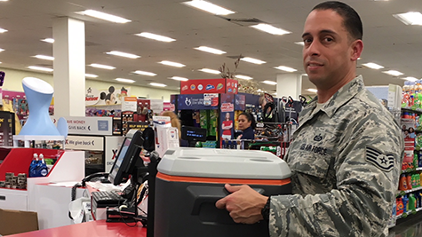 An Airman at Hurlburt Field, Fla., buys a cooler to prepare for Hurricane Michael.