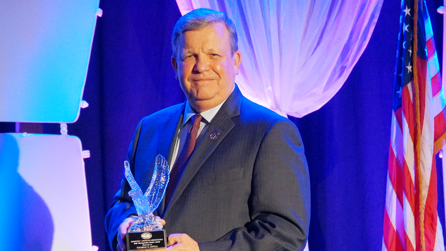 Director/CEO Tom Shull holds the ALA's Distinguished Service Award