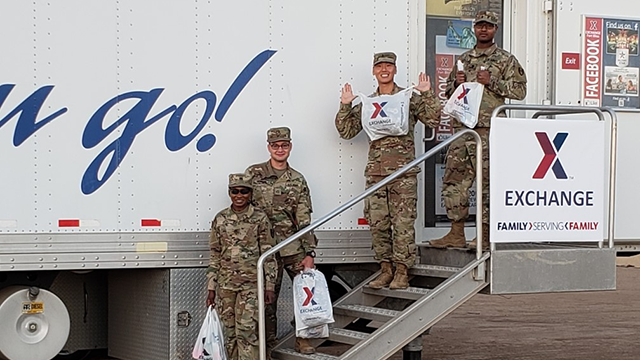 Soldiers come out of the mobile field exchange at Davis-Monthan AFB with sacks full of basic necessities.