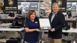 Debi Deleno-Dilello is honored by Exchange Director/CEO Tom Shull for her work managing the Military Clothing Store at the U.S. Military Academy in West Point, N.Y.