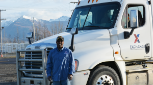 Amos Jeffery, his rig and majestic Alaskan mountains.