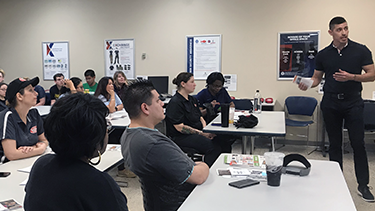 Roy Montez, the Exchange's BE FIT ambassador, talks to a class of food service workers at Fort Sill, Okla., about how to make better-for-you options.