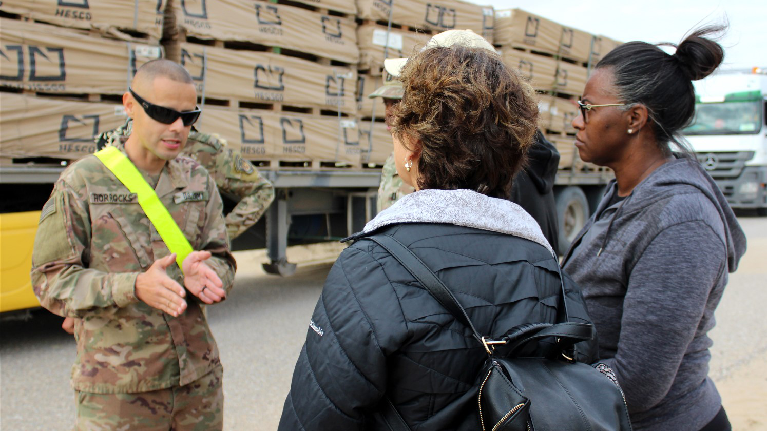 A member of the U.S. Army’s 595th Transportation Brigade explains to Exchange logistics leaders from Dallas the intricate process of getting merchandise from Kuwait to the Warfighters in Iraq.