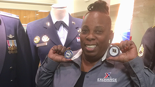 Karen Anderson shows the coins presented to her recently by the Secretary of the Air Force and the Air Force’s Chief of Staff.