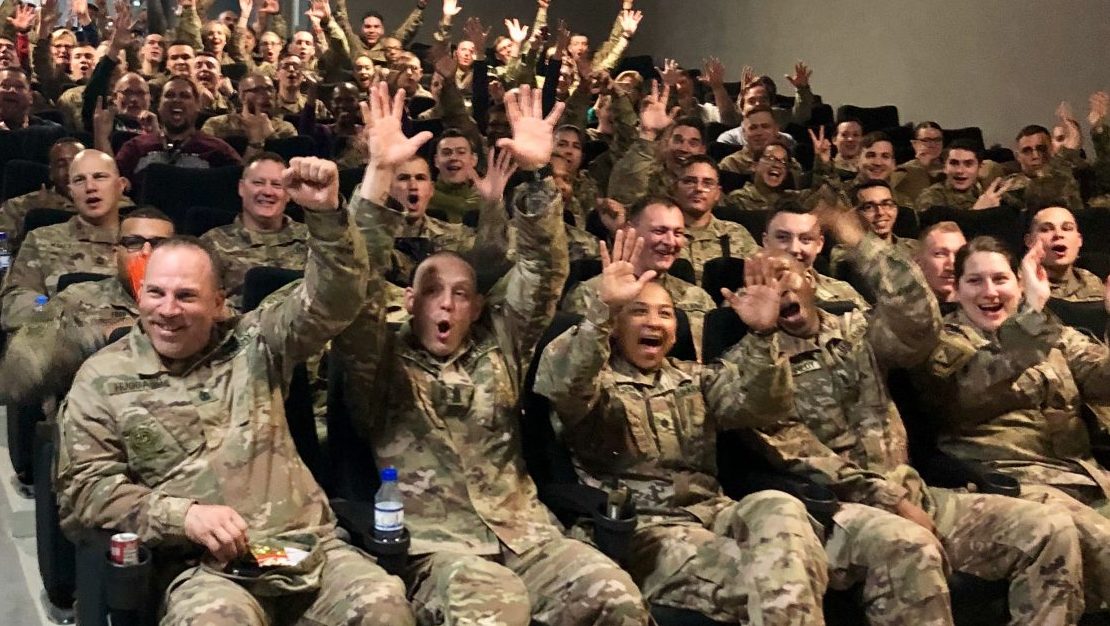 Soldiers at Camp REDLEG in the United Arab Emirates react with joy upon the premier in early March of the newest Captain Marval movie. The Exchange and Disney teamed to show the movie to troops throughout Southwest Asia.