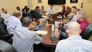 Leaders of the Exchange's Logistics Directorate meet with a member of the Headquarters, Department of the Army (HQDA) G-48 and a project manager to talk about transportation of goods to Warfighters.