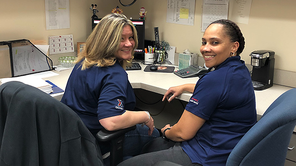 Mindy Whitman, left, logistics assistant at JB Langley-Eustis, works with fellow military spouse Yajaira Sanchez. Sanchez, a softlines stocker, is married to a Coast Guard member.