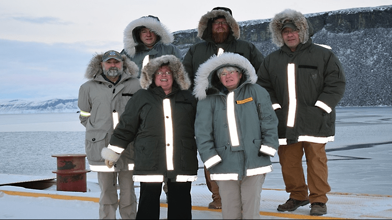 Frank Partridge, Thule store manager; Timothy Barba, shift manager; Osa Fatuesi, assistant store manager; Bill Miele, shift manager; Deborah Mills, barber; and Phyllis Blackburn, store manager, are serving at the Thule Exchange in Greenland.