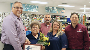 Eighty-four-year-old Charlsie Dean celebrates her golden anniversary with the Exchange at the Fort McClellan National Guard Troop Store. Joining her in a picture are, left to right, Jesse Martinez, southeast region vice president, who is presenting her with a Thanks award; Don Sydlik, general manager; Lucretia Palmer, McClellan store manager; and John Seward, regional HR manager.