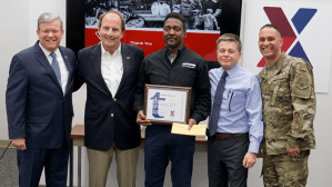 Willie Eagle, center, was honored by Director/CEO Tom Shull, Senior Vice President of Supply Chain Transportation Tom Lozier, Chief Operating Officer Dave Nelson and Chief Master Sgt. Luis Reyes, Exchange senior enlisted advisor, for working at the Exchange for 50 years.