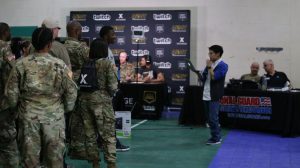 Soldiers stand in line to register for the Road to Twitchcon event at Camp Mabry