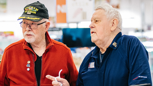 Veteran Christopher Daddato, right, works for the Exchange at Germany's Ramstein AB.