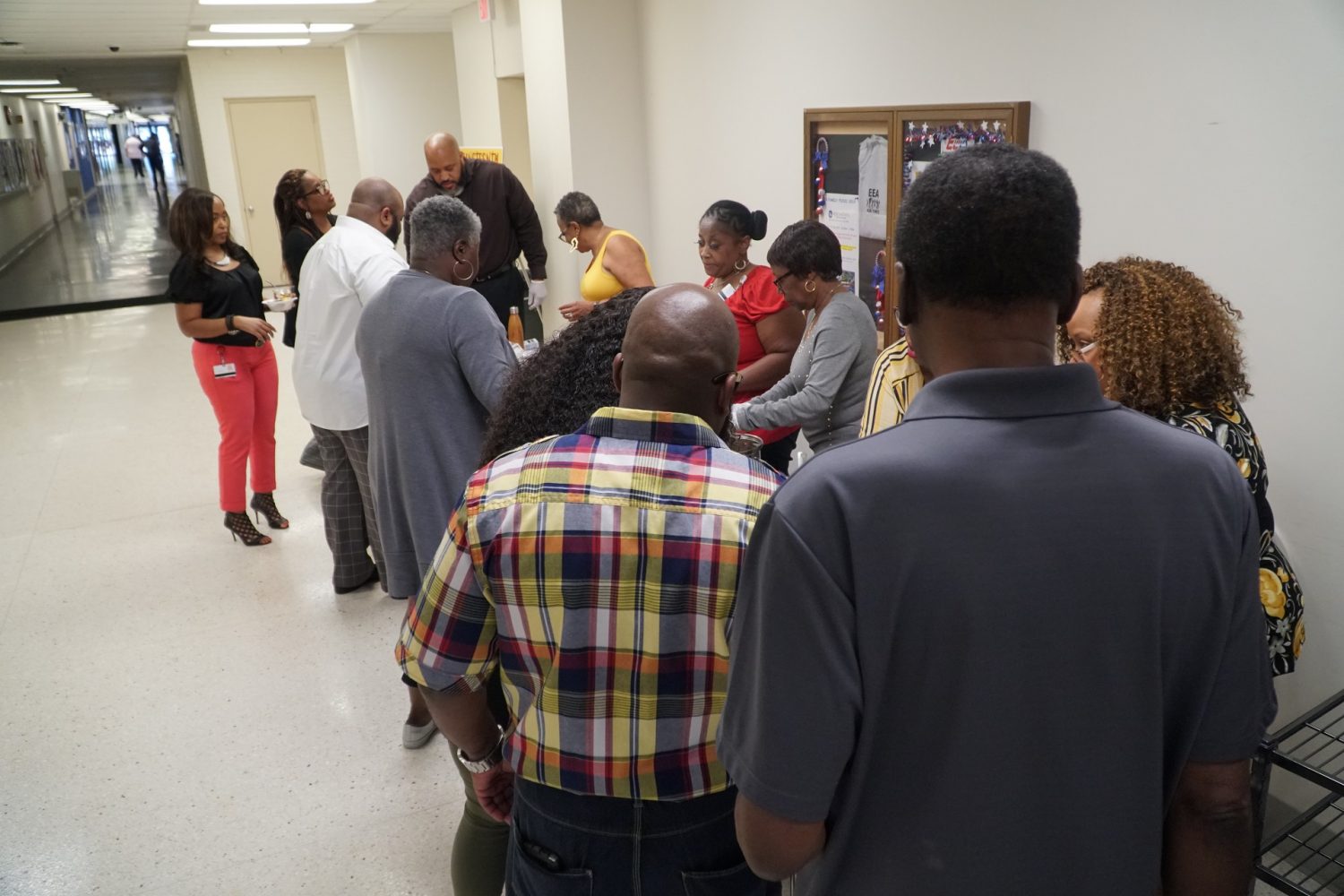 associates lined up for food samples