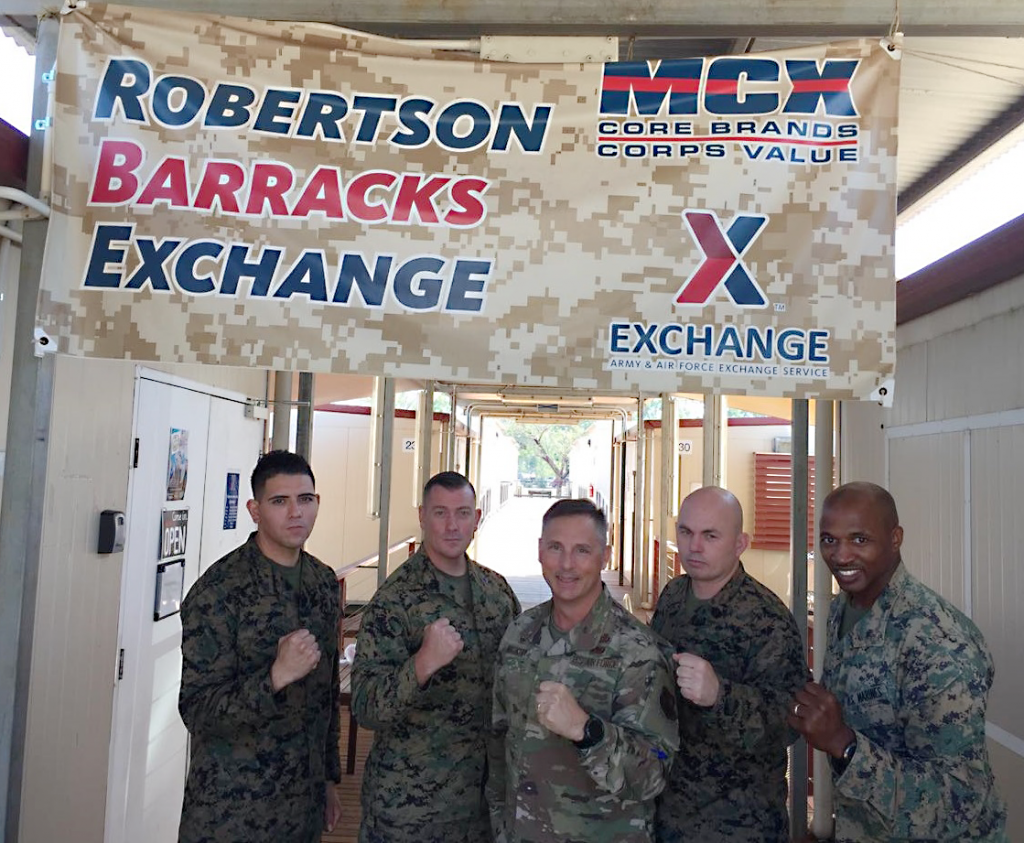 Pacific Pride in Australia! Exchange Pacific Region Commander Col Scott Maskery, center, presents his Commander’s Coin to U.S. Marines running the mobile field exchange at Camp Robertson Barracks. From left to right: SGT Angel Mendoza, GySgt Jonah Thomas, MGySgt Christof Coleman and CWO4 Montreal Newkirk.