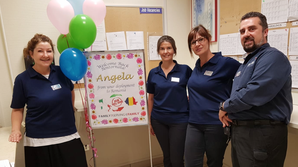 Angela Morson, center, is welcomed back to Aviano AB by, left to right, Linda Vivan, Selena Mazzega and Store Manager Boris Nasci. 
