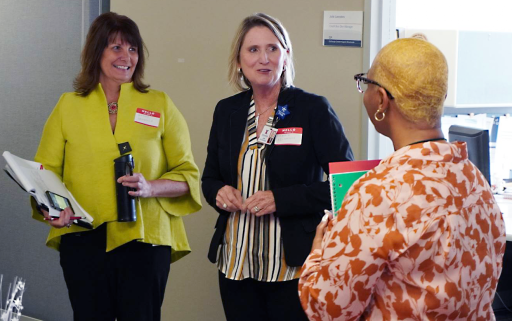 Vice President Kathy Bronkalla and Senior Vice President Jami Richardson participated in mentoring associates like Yashica Edwards, right, a Customer Contact Center manager, about their professional goals.