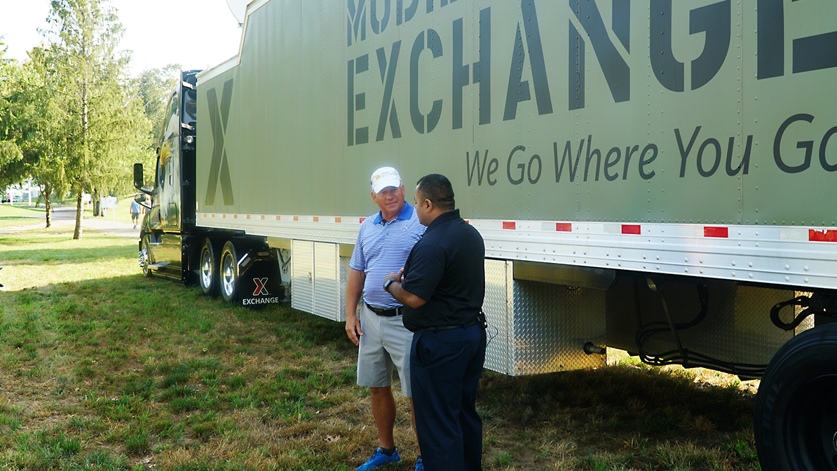 Retired LTG Raymond V. Mason, director of Army Emergency Relief, left, talks with the Exchange's VSO/MSO Outreach Manager Jose Hernandez in front of a mobile field Exchange at
A Military Tribute at the Greenbrier, the first stop of the 2019-2020 PGA Tour.