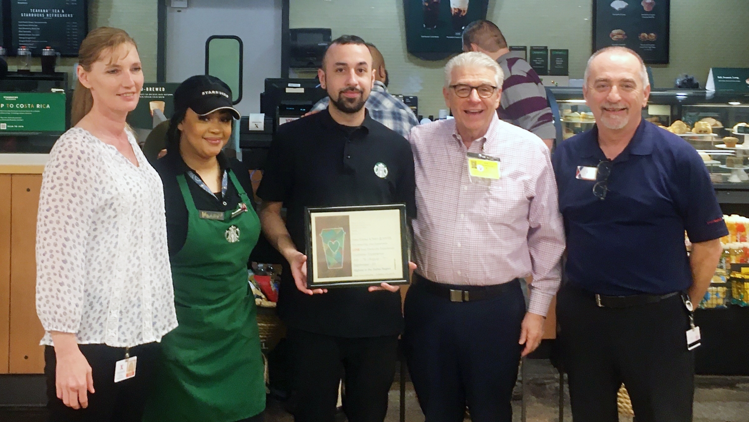 Left to right, Exchange manager Linda Densmore; Starbucks foremen Starbucks Foremen Kela Williams and Joseph Gomez; Starbucks District Manager Gus Dracopoulos; and Food Court Manager   Michael Blankenship.