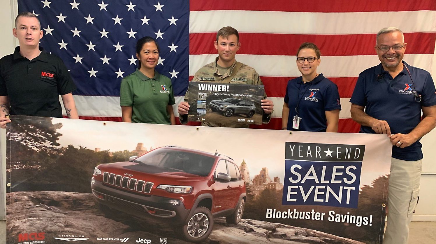 Posing with the winner are, left to right, Military Auto Sales’ Lee Kearney; Associate Lovely Novella; Store Manager Sydney Bierman; and Associate Frank Tejeda.