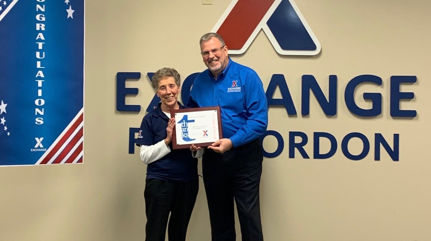 Eastern Region Senior Vice President Bob White presents associate Evelyn Huskins with her 50-year service award.