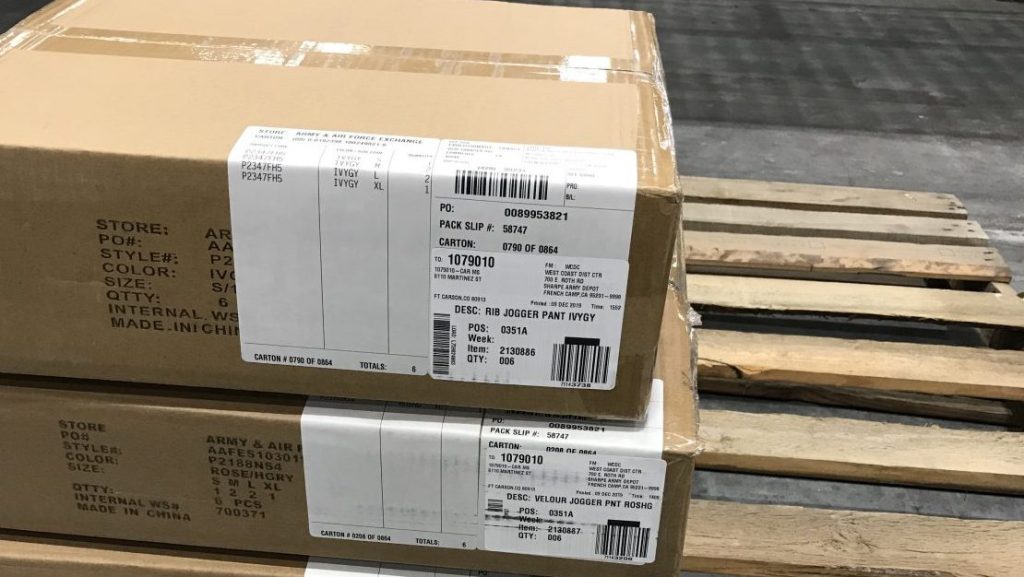 While fashions used to come on hangers, they now come in boxes. Three boxes of fashions await shipment from the West Coast DC to Exchanges in that part of the United States.