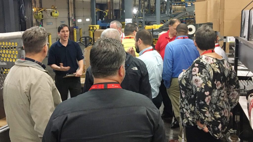 The Waco DC's ecomm shipping department is taking on greater significance as more Exchange shoppers turn to online purchases,
Operations Manager Paul Monda, in blue, tells Loss Prevention leaders.  